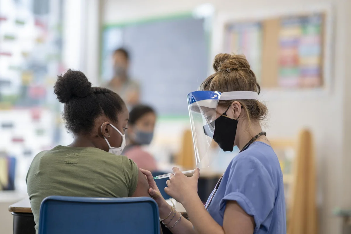 Student getting vaccinated