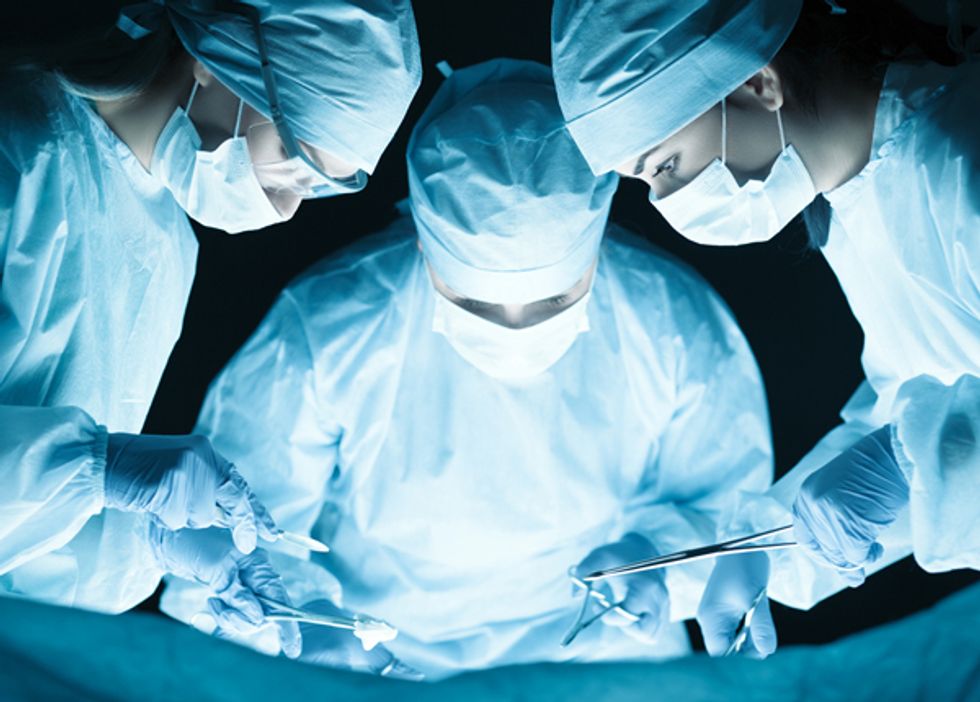 surgeons performing surgery