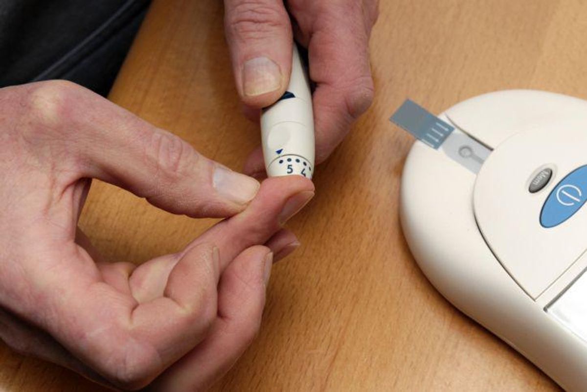 taking blood sugar level with a finger prick