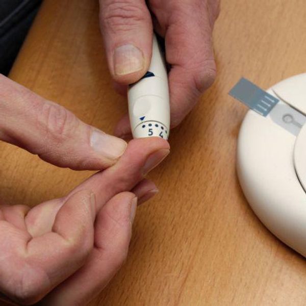 taking blood sugar level with a finger prick