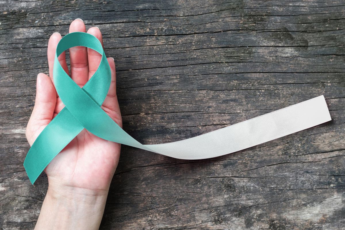 Teal and white ribbon for Cervical Cancer awareness