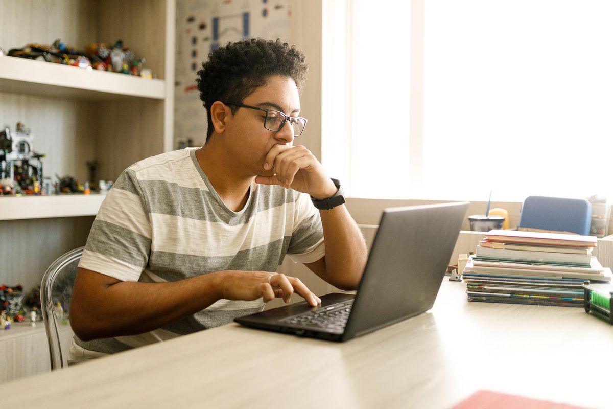 teen boy on laptop