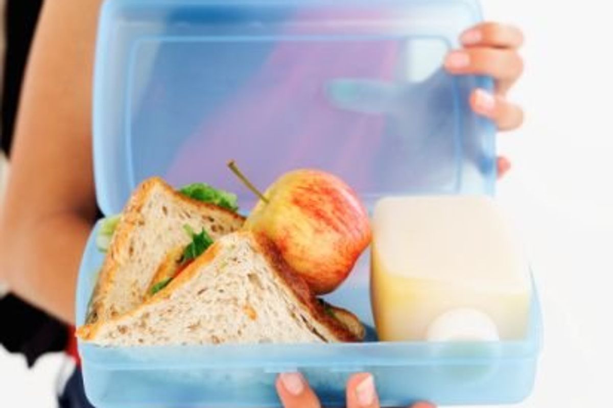 teen holding a lunch