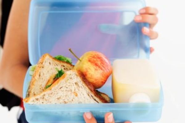 teen holding a lunch