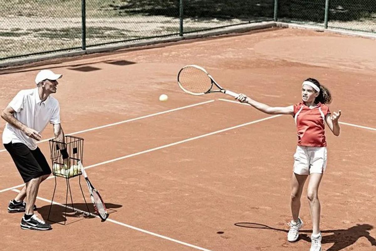 teen playing tennis