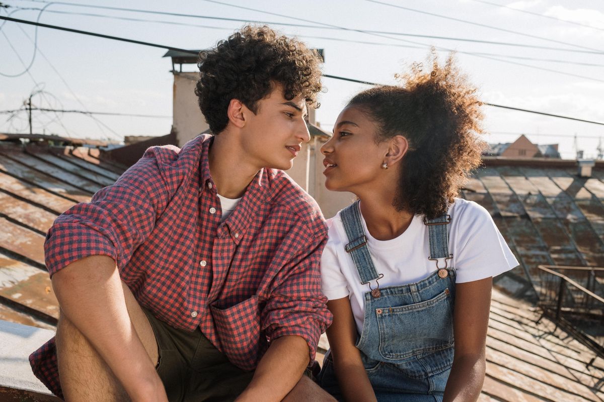 teenage couple on a roof