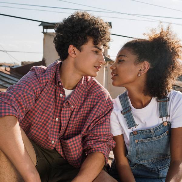 teenage couple on a roof