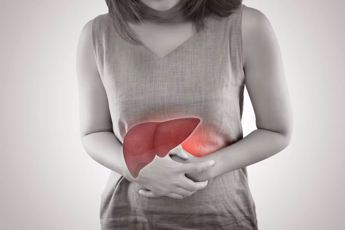The Photo Of Liver On Woman's Body Against Gray Background