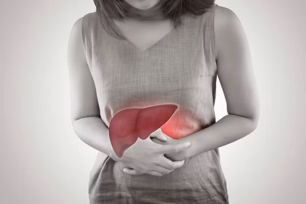 The Photo Of Liver On Woman's Body Against Gray Background