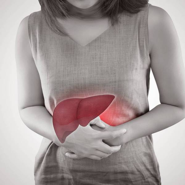 The Photo Of Liver On Woman's Body Against Gray Background