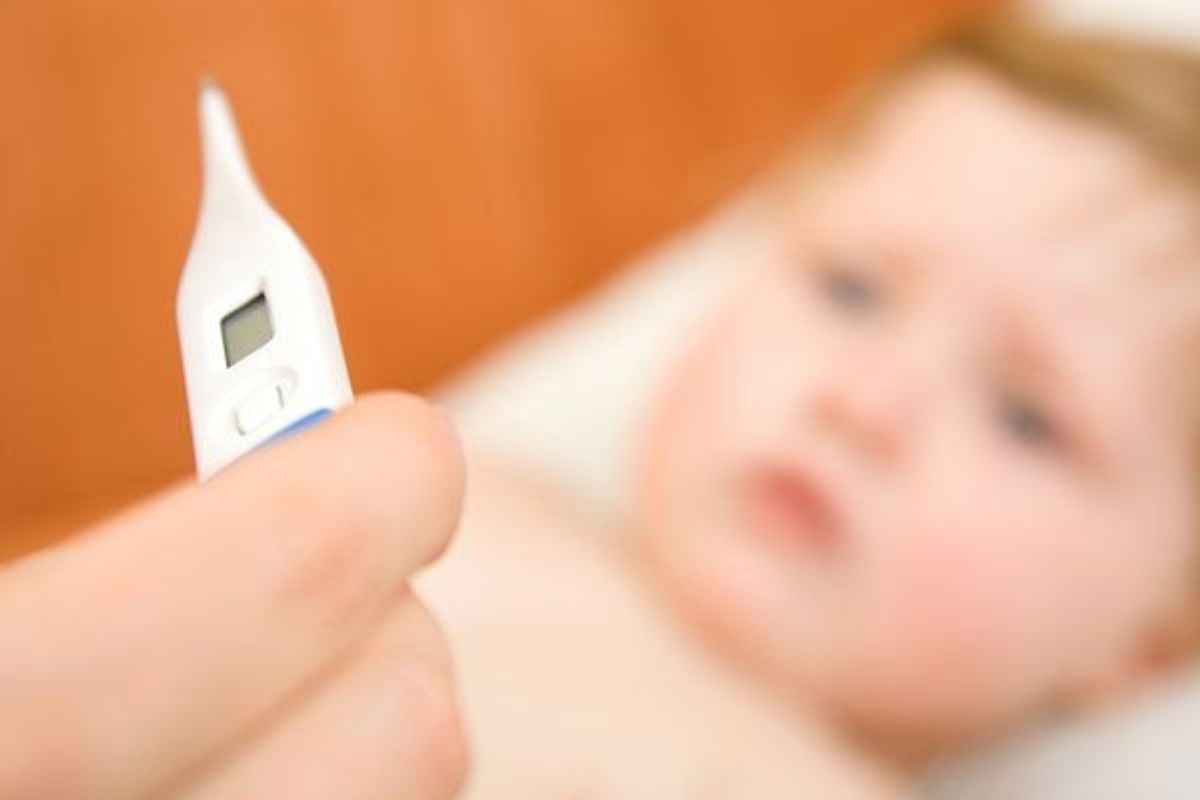 thermometer and a baby