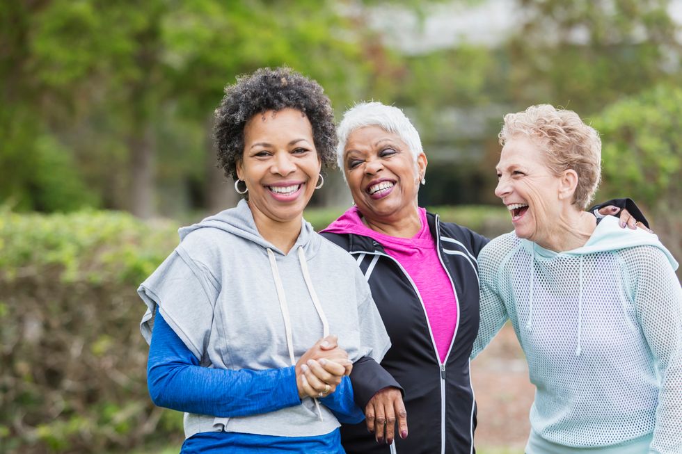 Three older multi-ethnic women hanging out together