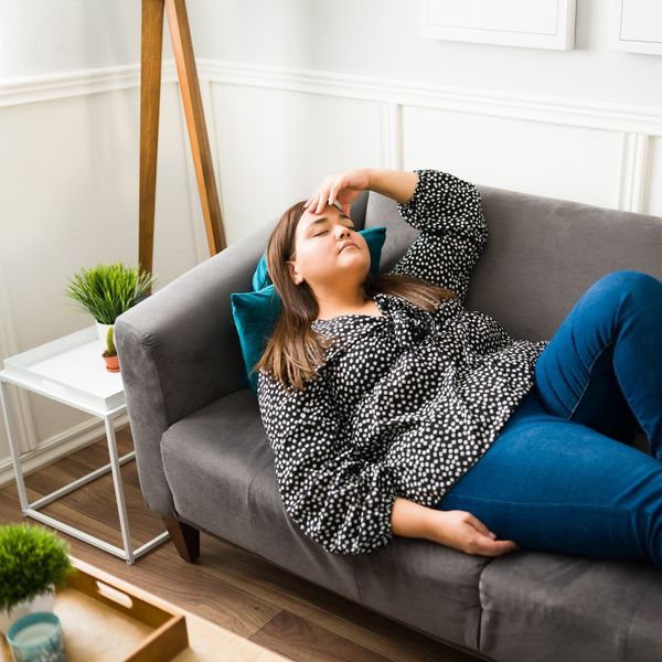 tired overweight woman suffering from a chronic fatigue syndrome