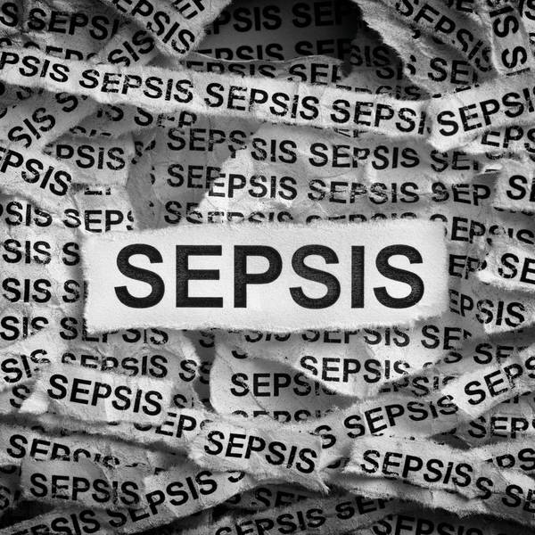 Torn pieces of paper with the word Sepsis