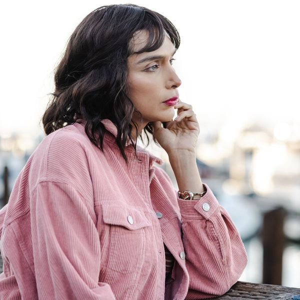 Transgender person contemplating and looking at the view