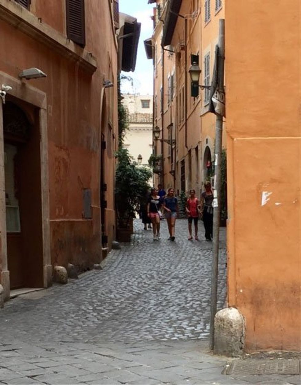 Trastevere is a quaint neighborhood with cobblestone streets.