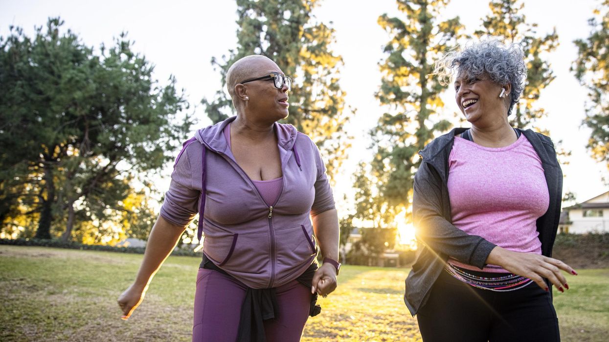 Two black woman walking