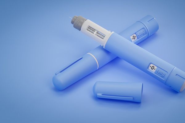 Two dosing pens of a fictitious drug used for weight loss