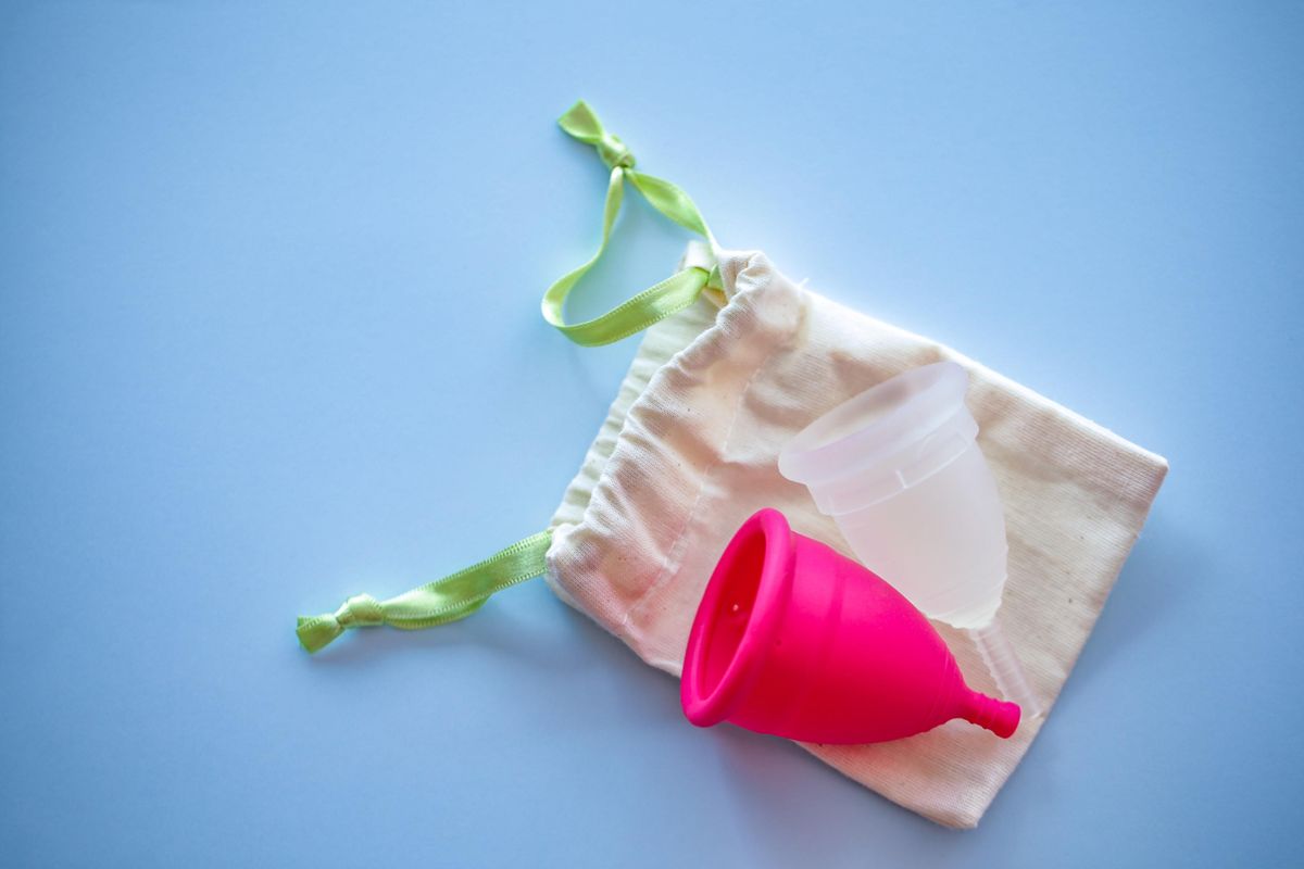 Two Menstrual cups of different sizes and colours