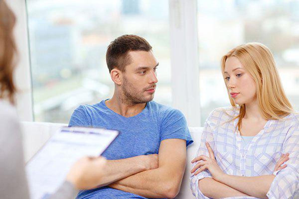 unhappy couple in doctor's office