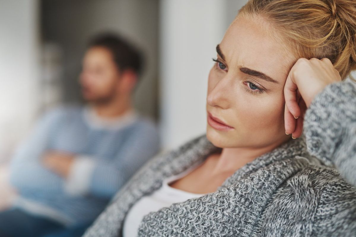 unhappy young couple after a fight at home