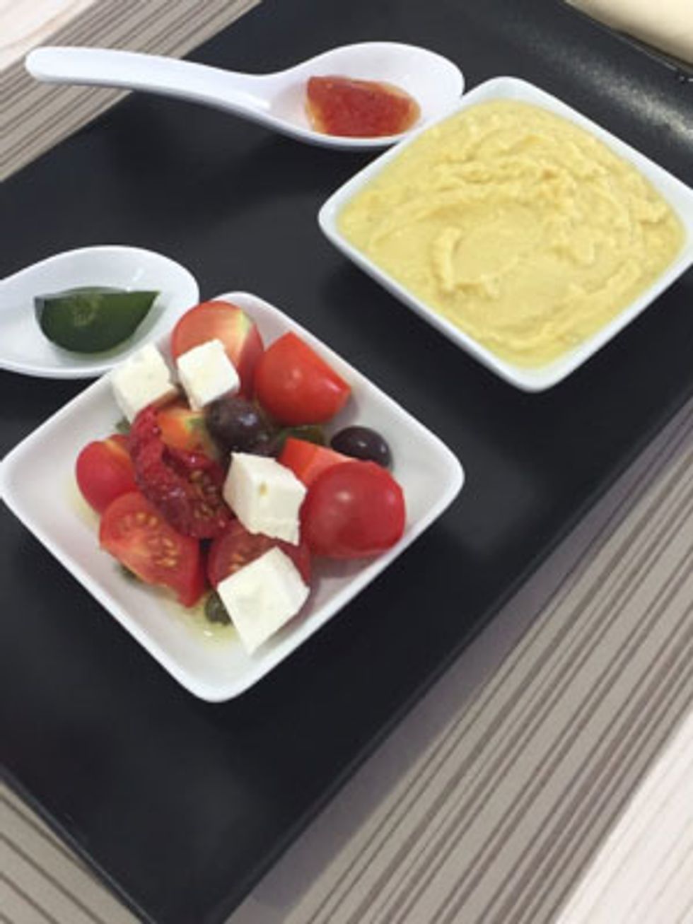 We sampled creamy cooked fava beans and cherry tomatoes.