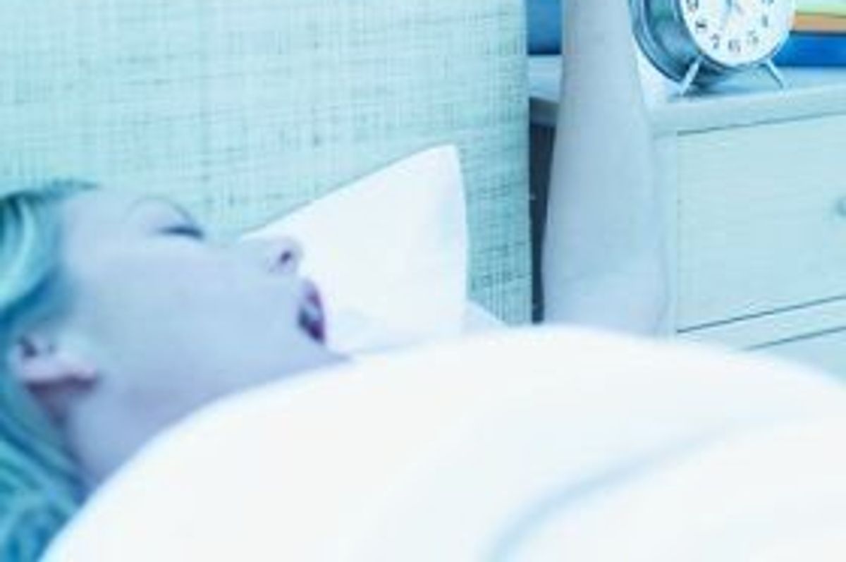 woman awake and yawining