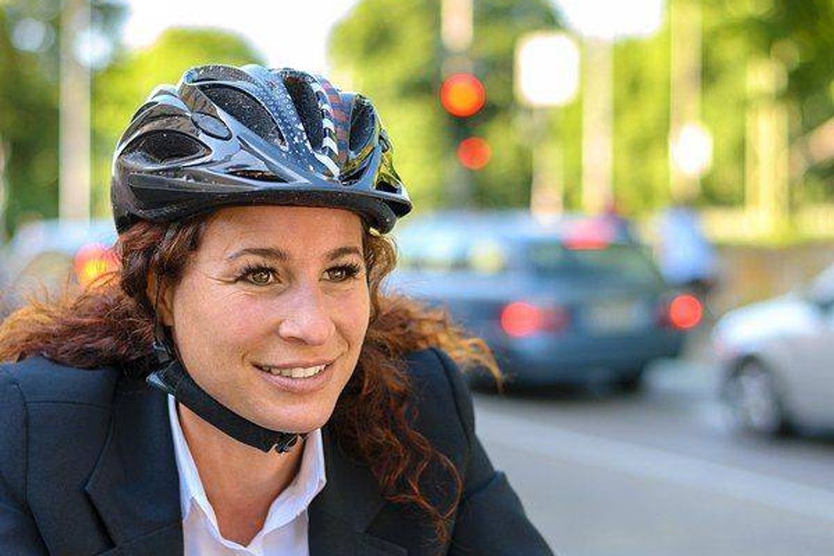 woman biking to work