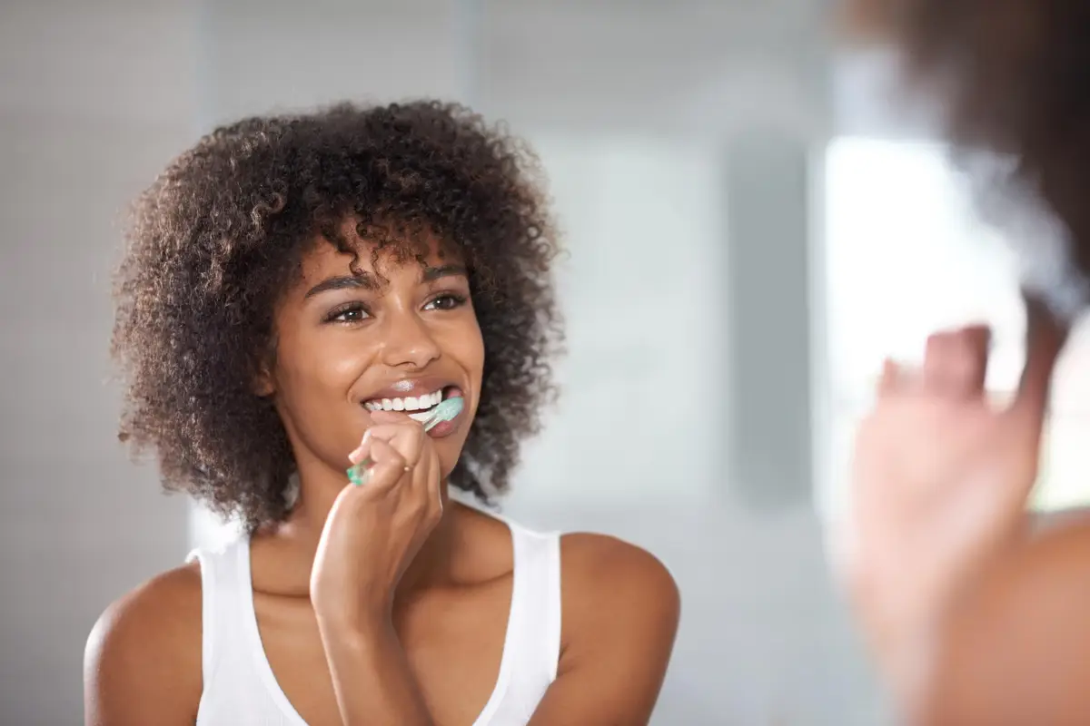 woman brushing her teeth