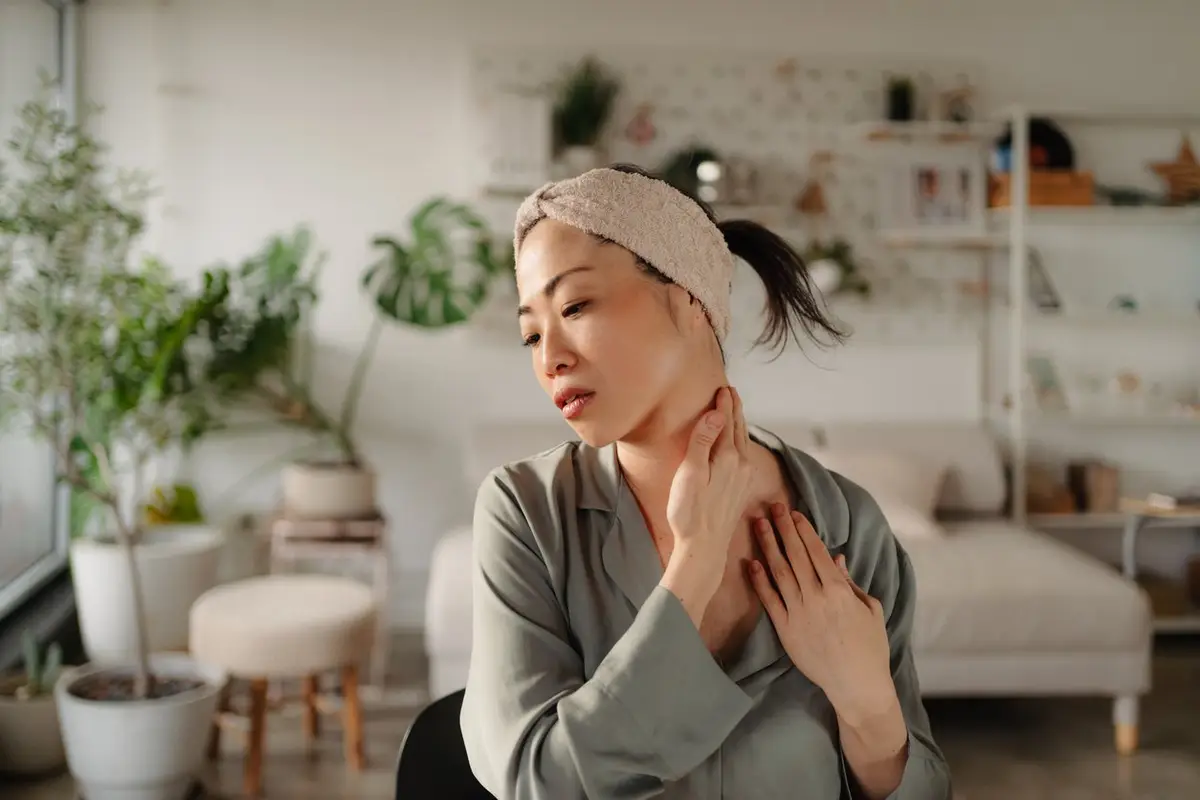 woman checking head and neck cancer symptoms
