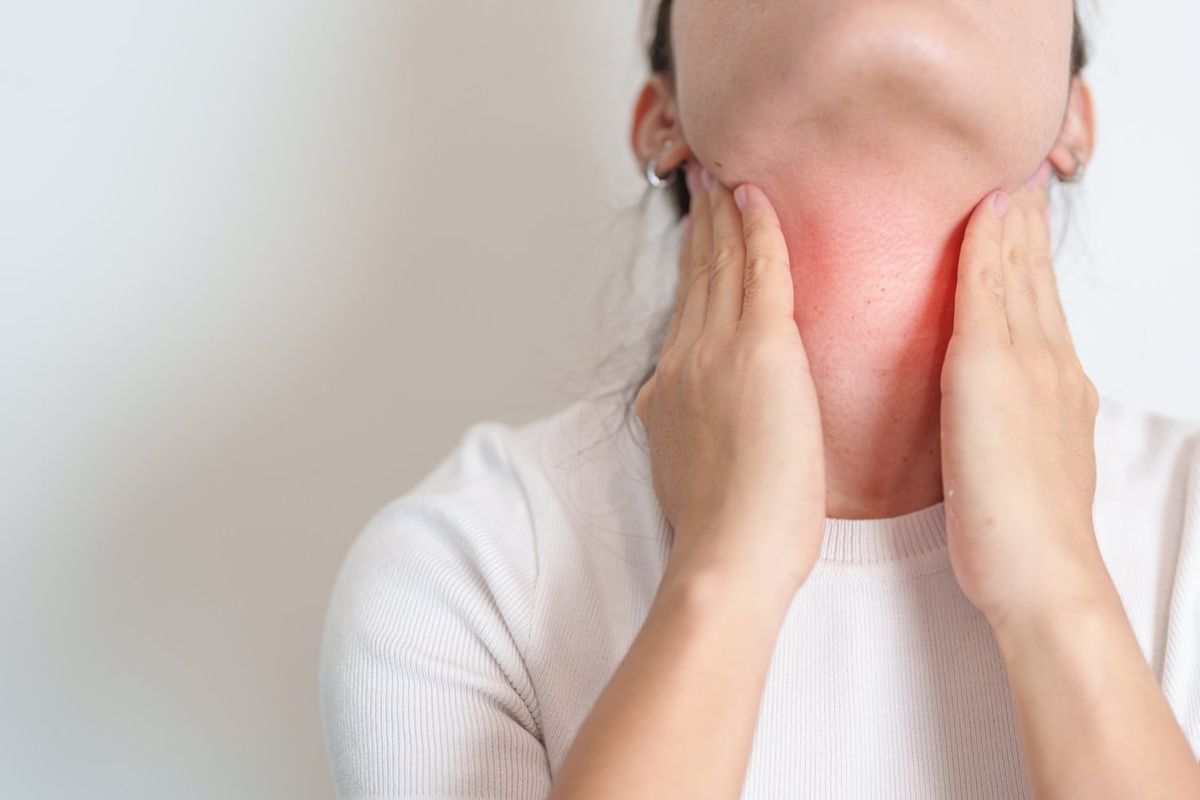 Woman checking Thyroid gland