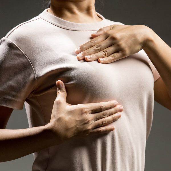 Woman does a breast self exam