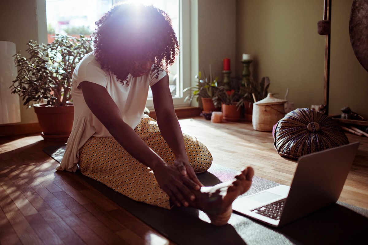 woman doing yoga at home