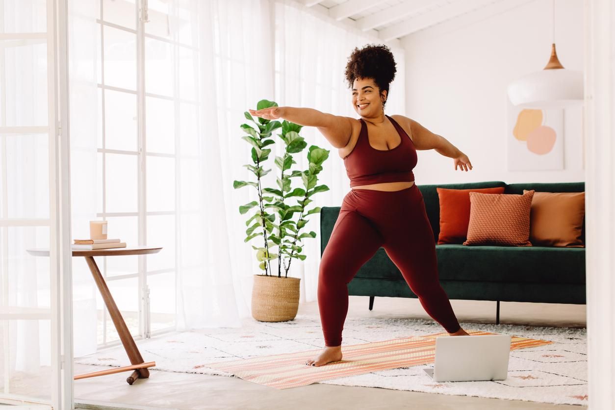 woman doing yoga at home