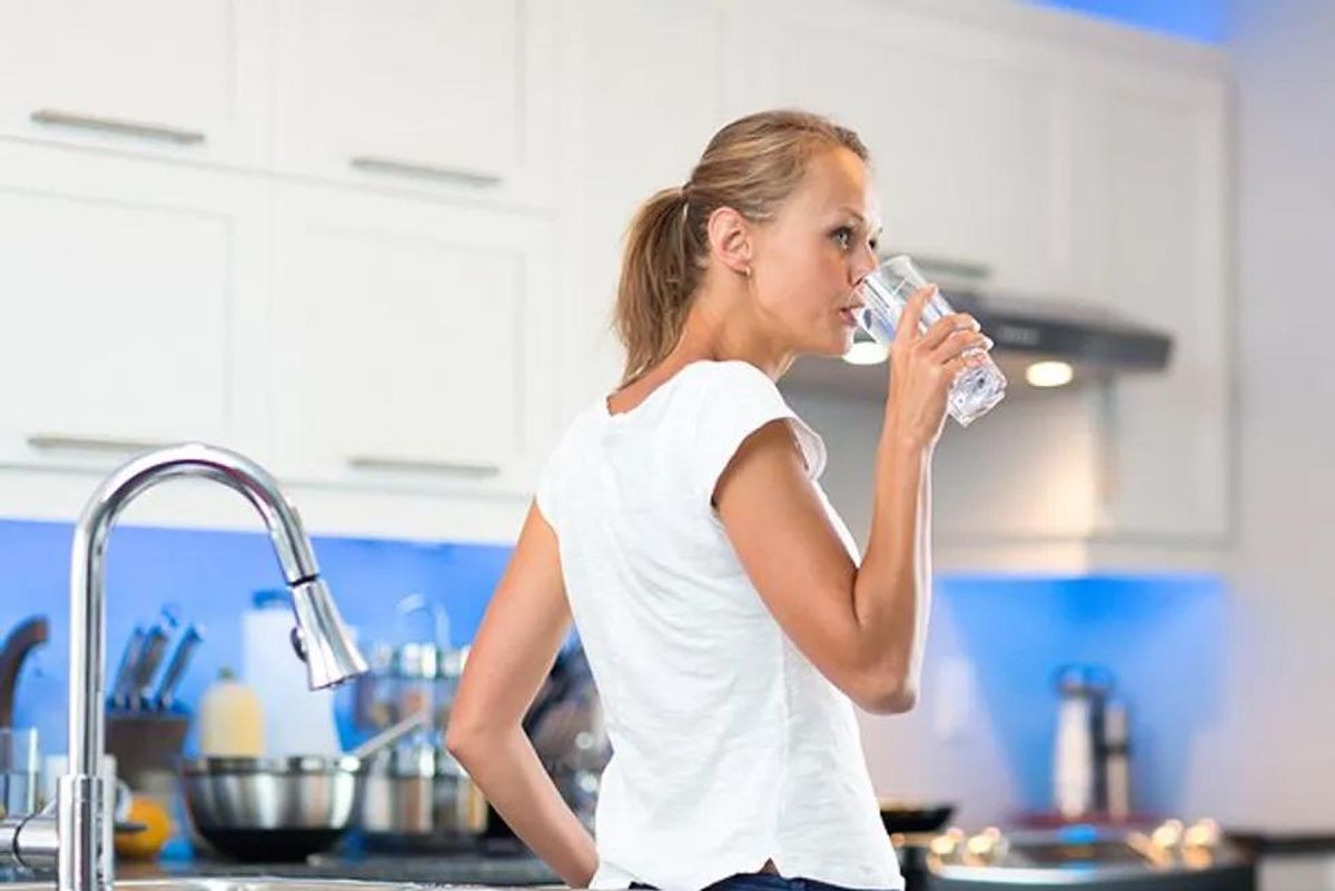 woman drinking tap water