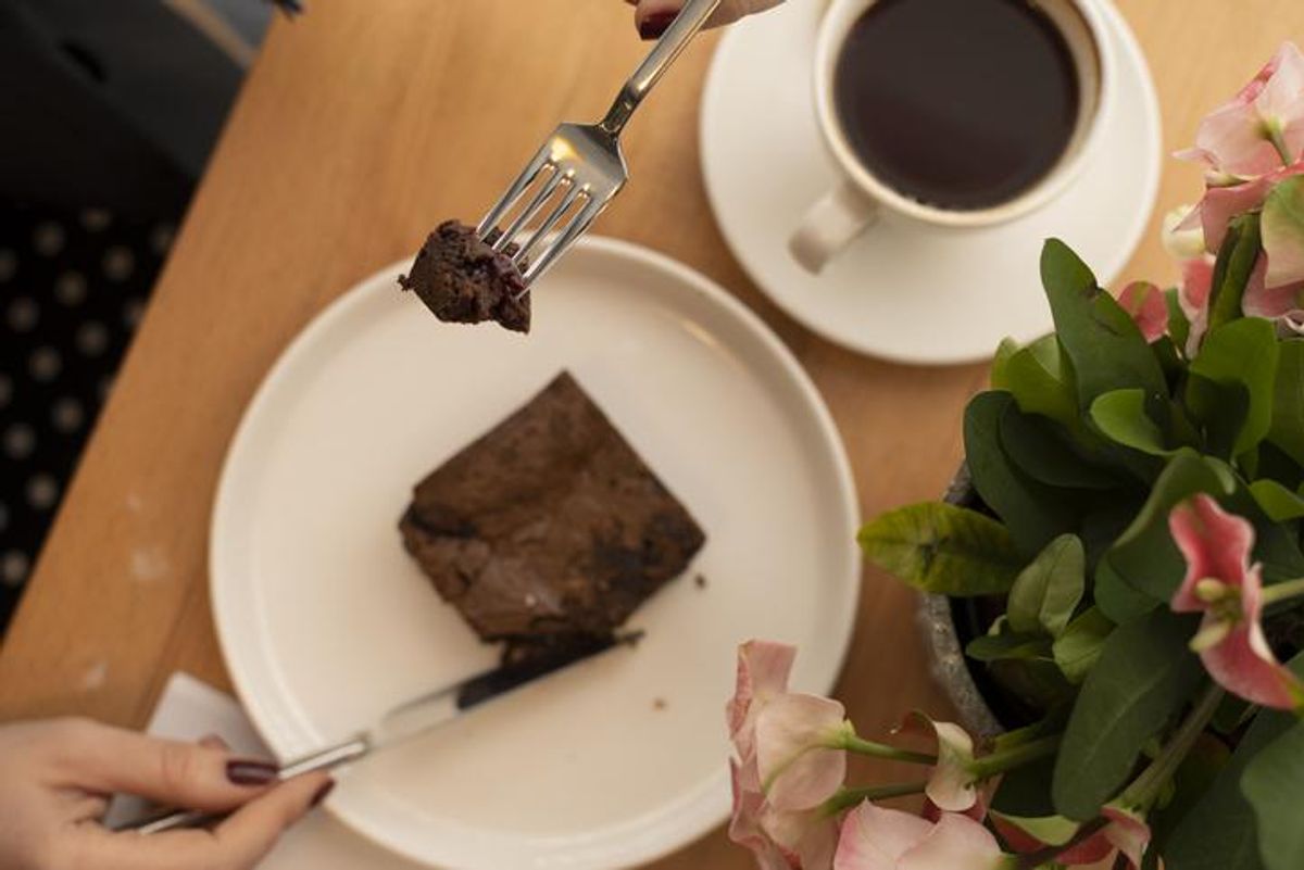 woman eating a brownie