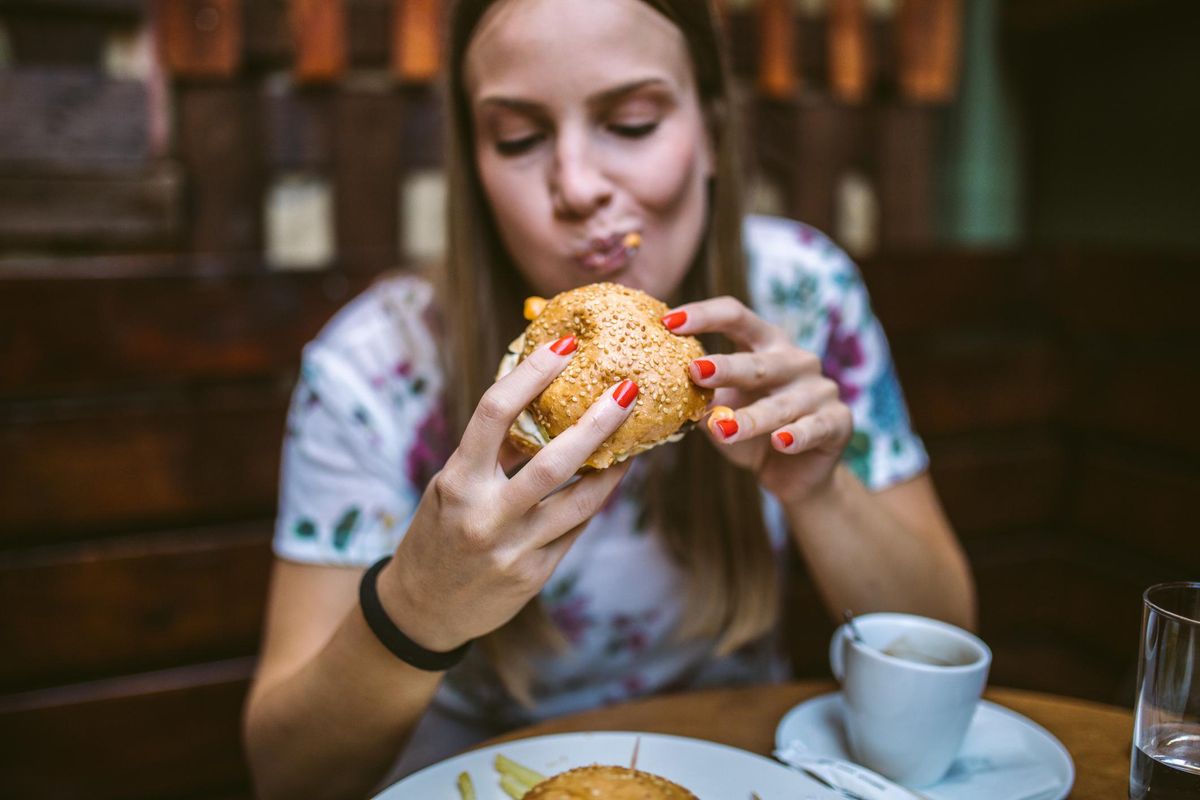 woman eating a burger