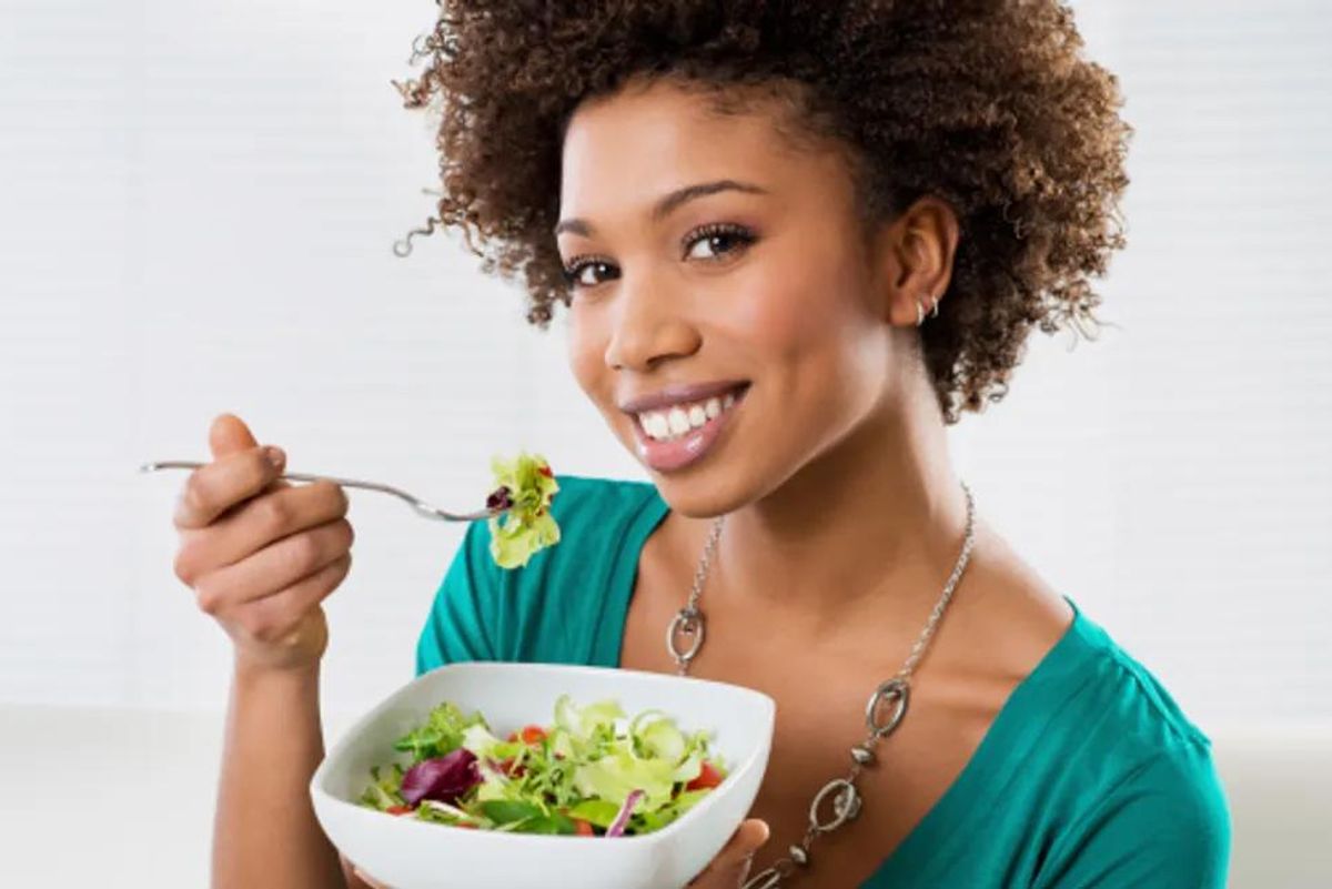 woman eating a salad for heart health