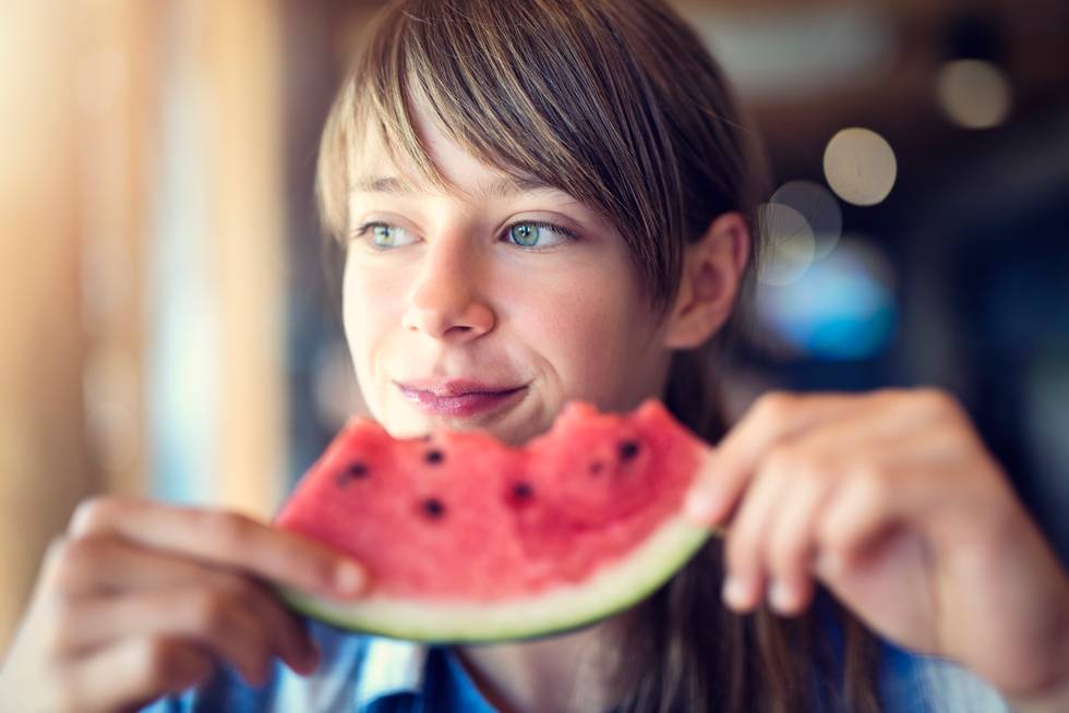 woman eating a watermelon