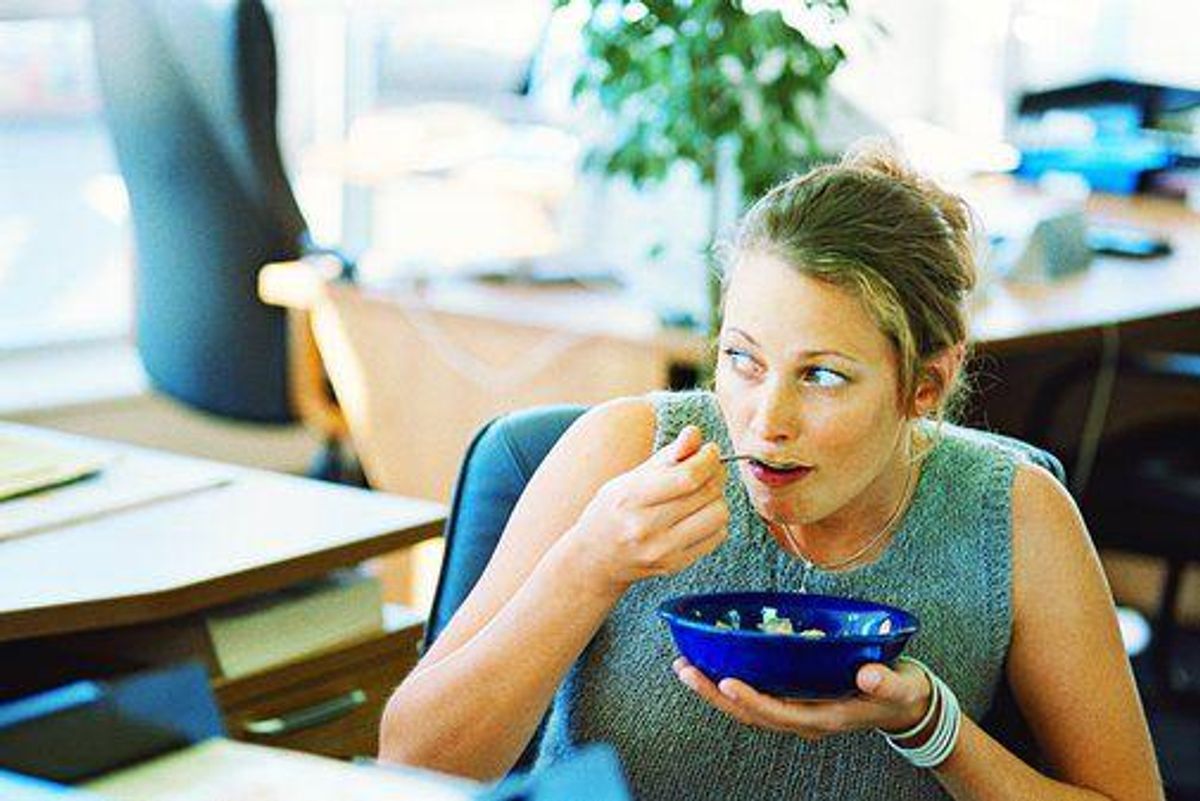 woman eating while stressed