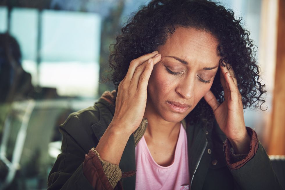 woman experiencing a headache