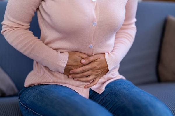 Woman experiencing stomach pain