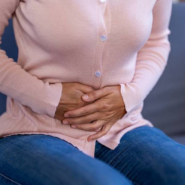 Woman experiencing stomach pain