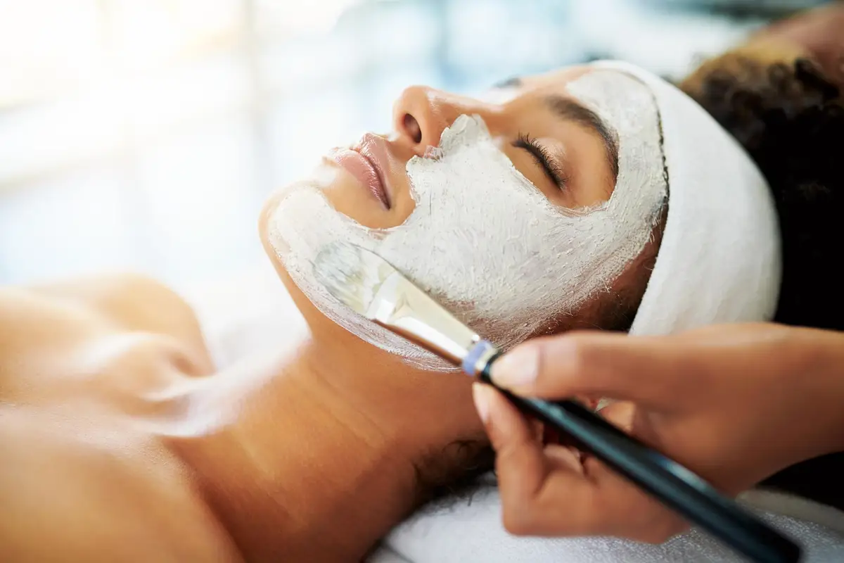 woman getting a chemical peel on her face
