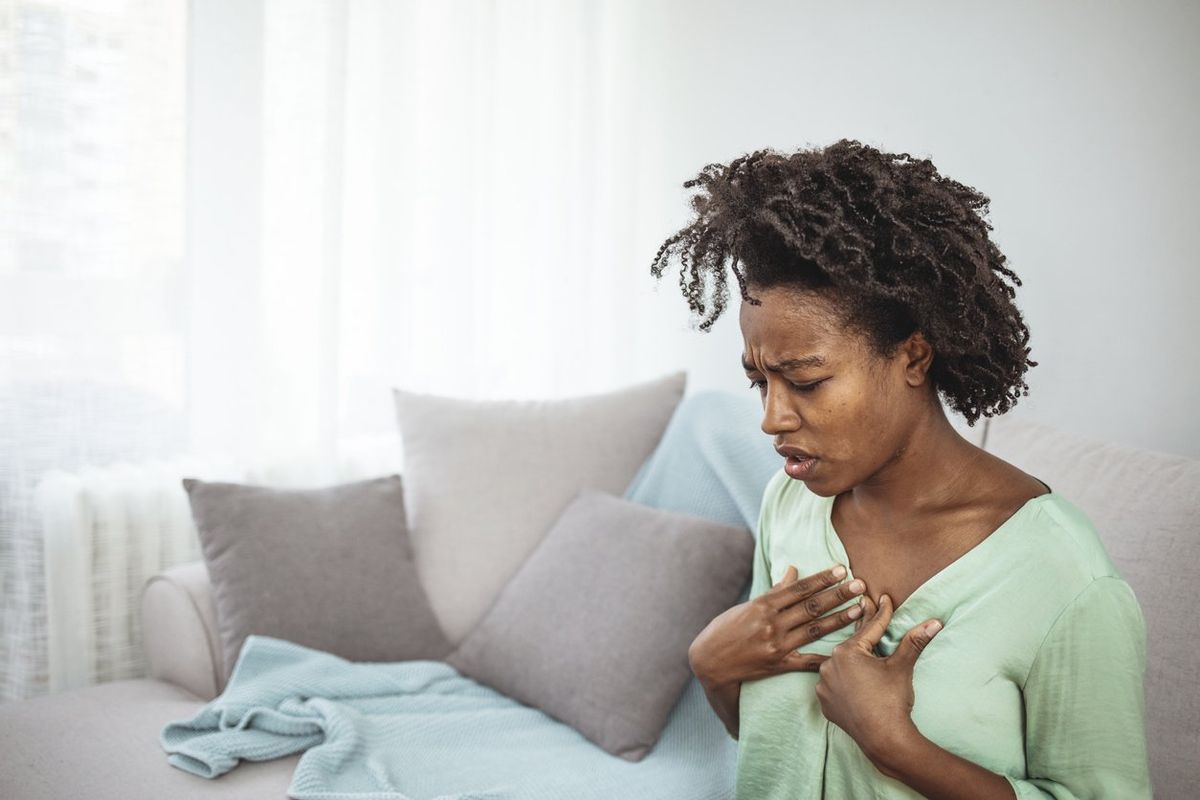 woman having chest pain