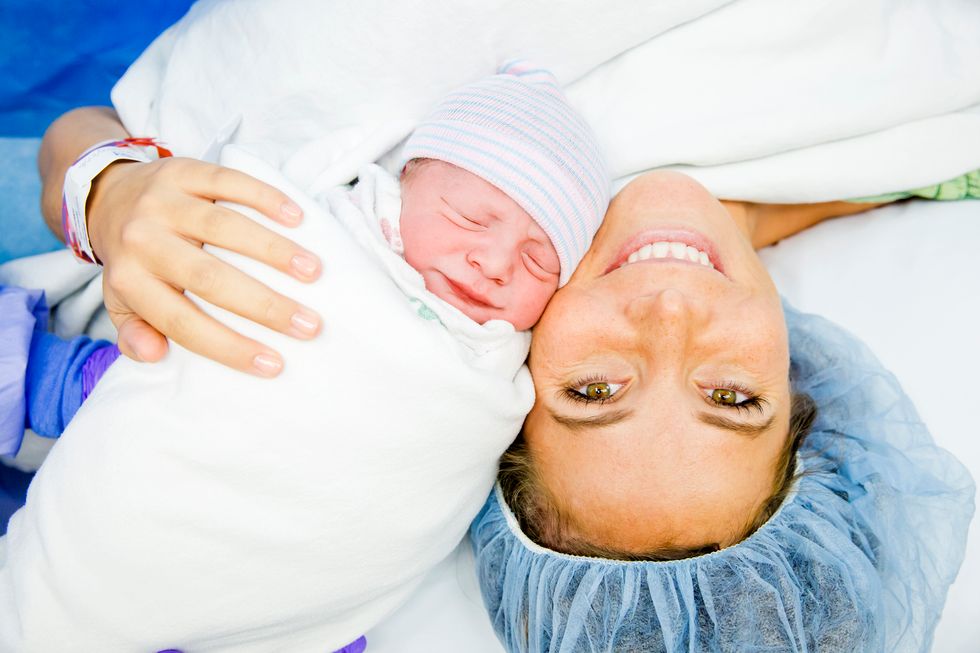 woman having just given birth to her baby via c-section