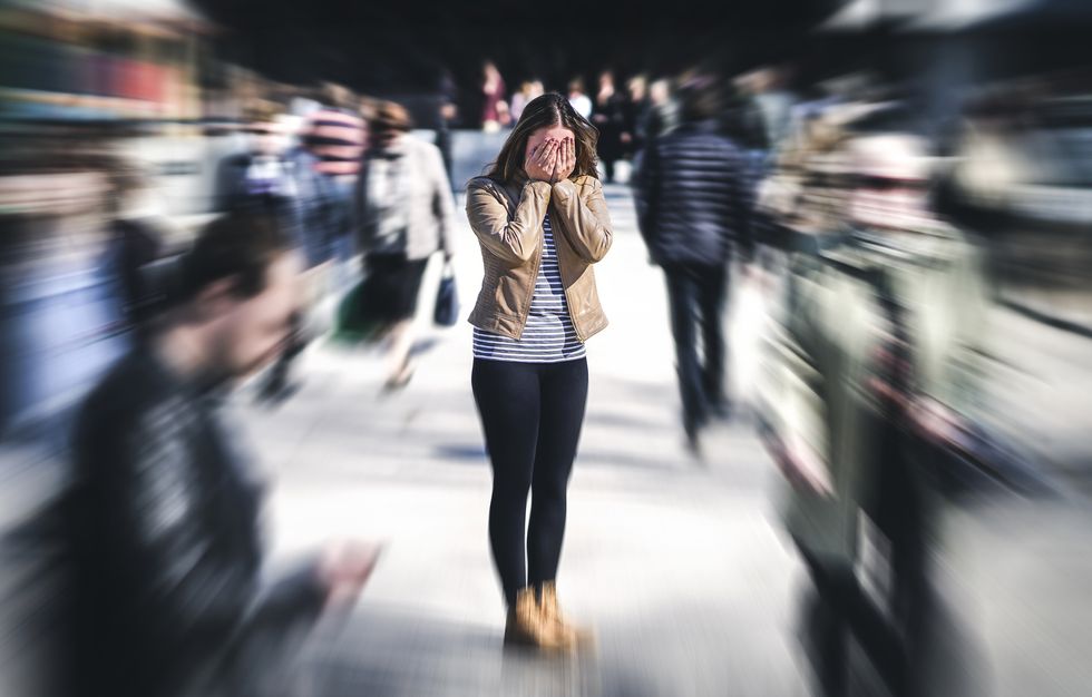 Woman having panic disorder in city