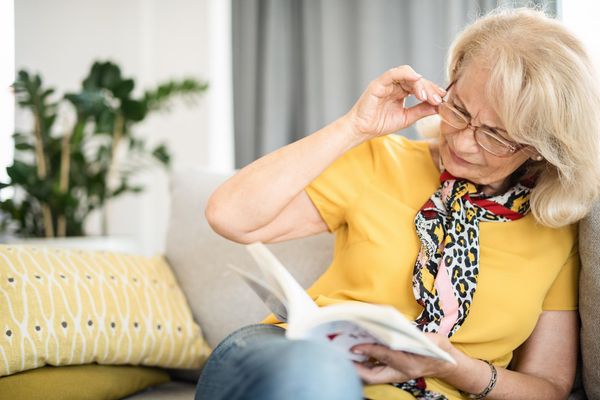 woman having trouble reading