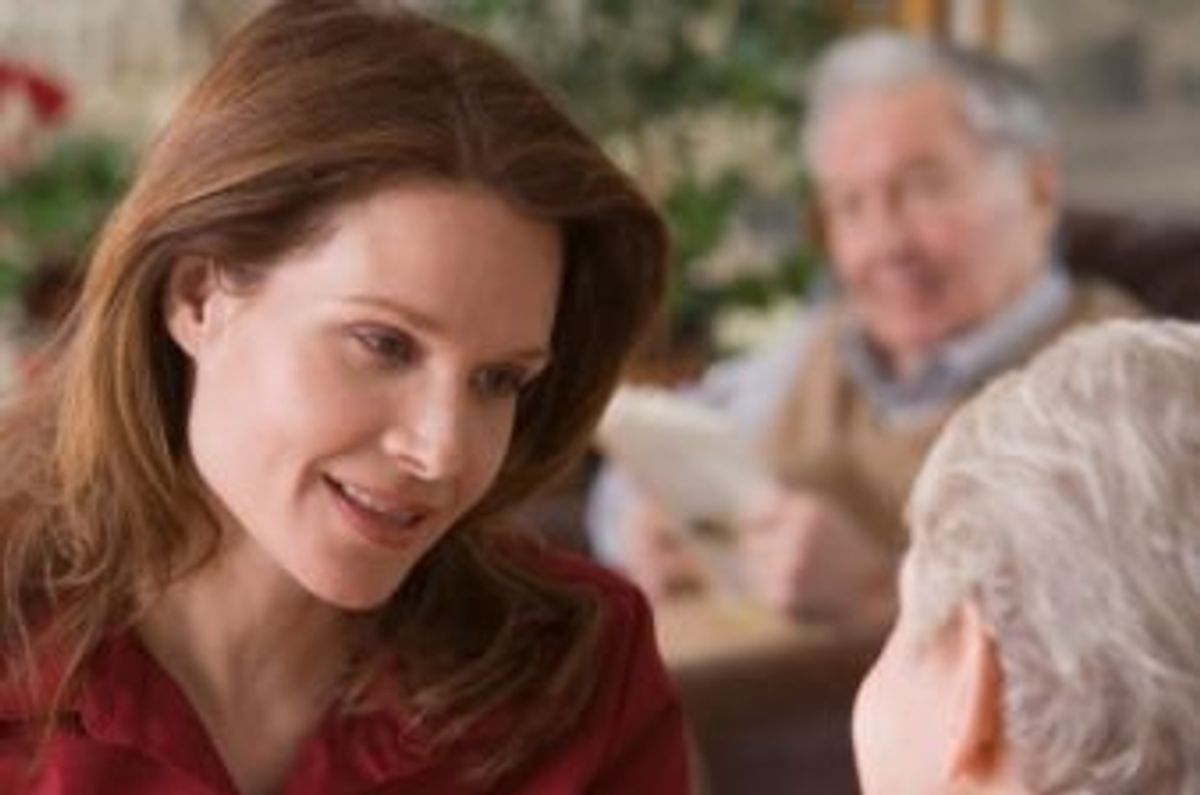 woman helping an elderly woman with her finances