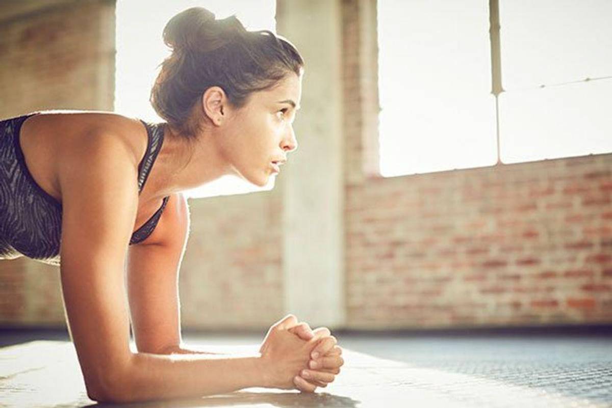 woman holding a plank
